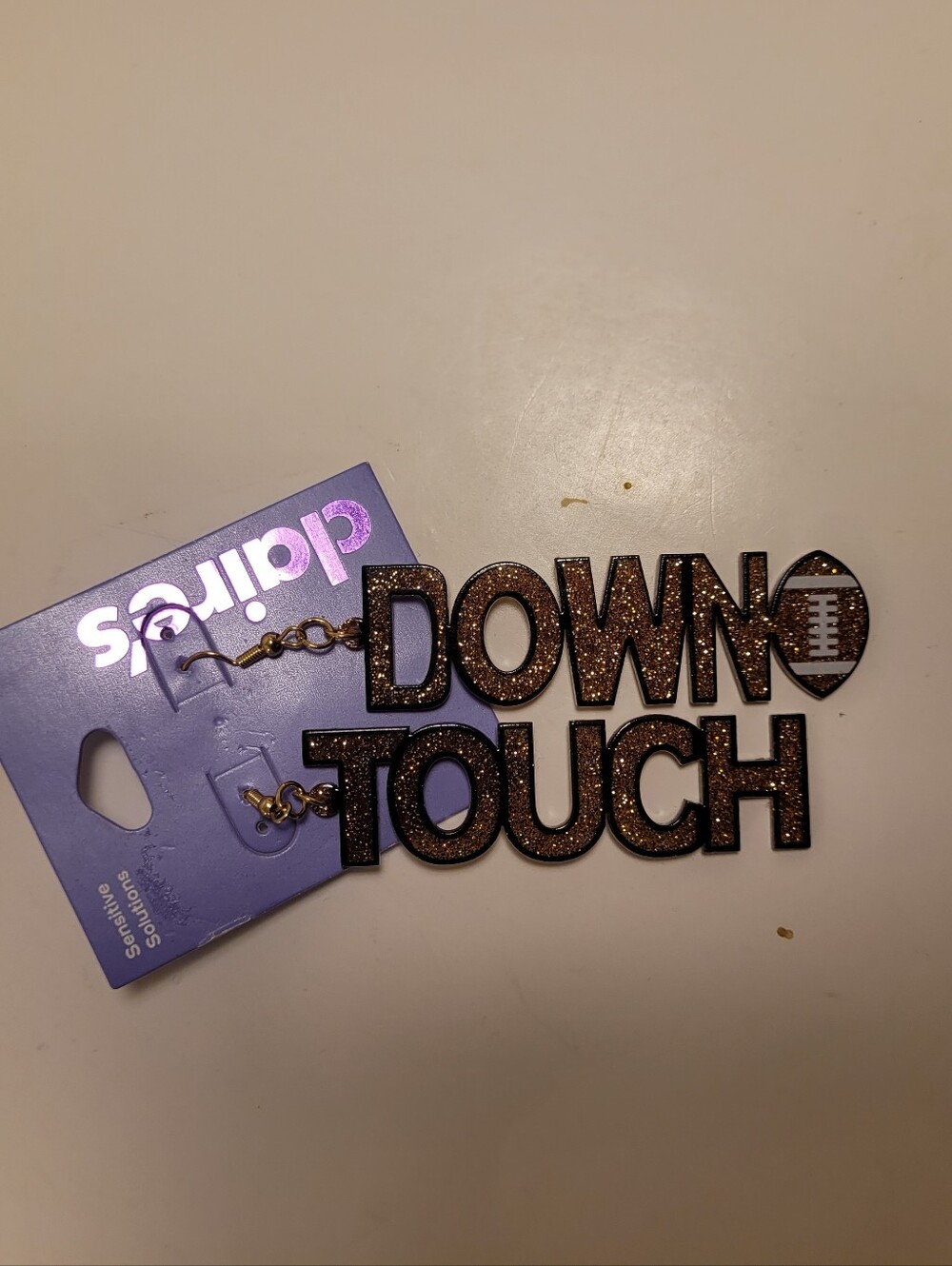 Claire's Glittery Brown "Howdy" and "Down" Football Dangle Earrings